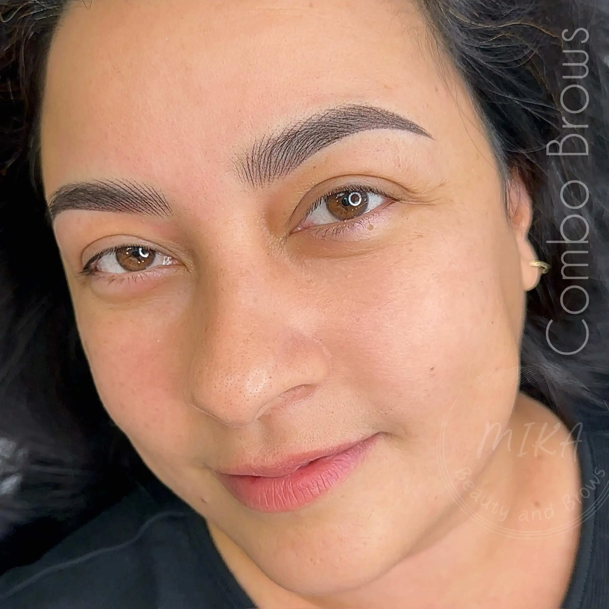 Combo brows with natural hairstrokes and soft shading for fuller defined permanent makeup eyebrows